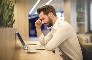 Man suffering from migraine headache